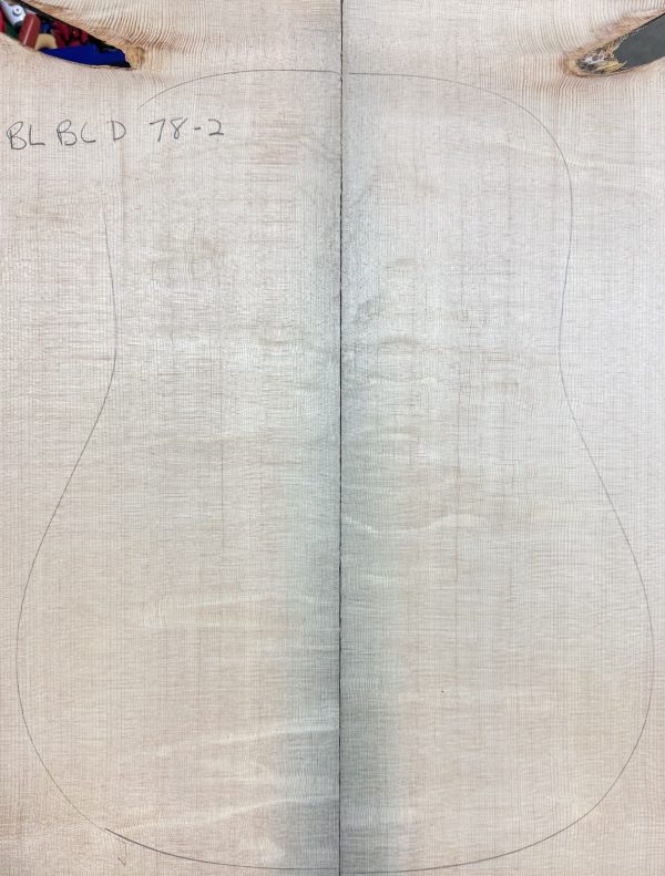 Book-matched Blue Bearclaw Guitar Tops with an acoustic guitar body outline drawn on them.