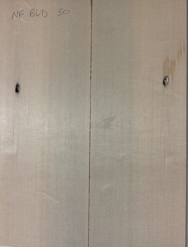 Pair of light-colored, book-matched Sitka Spruce guitar tops with fine vertical grain and natural knots, marked 'NF BLD 30'.