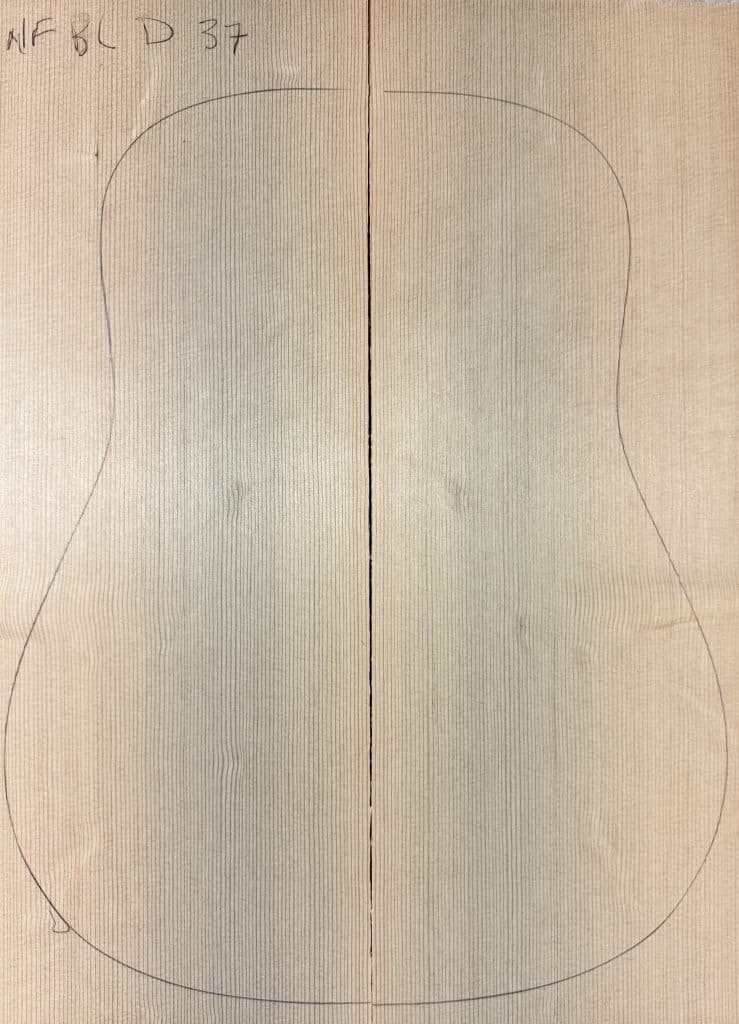 Pencil outline of a guitar body on joined pale, finely-grained wood boards, labeled NFBLD D 37, representing Non-Figured One-of-a-Kind Guitar Tops.