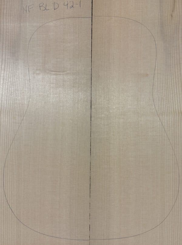 Book-matched light-colored Sitka Spruce tonewood with a guitar outline, ready for Non-Figured Guitar Tops.