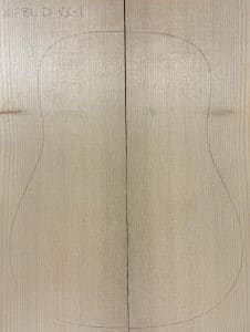 Book-matched Sitka spruce blanks with a pencil-drawn guitar body outline, demonstrating the raw material for One-of-a-Kind Guitar Tops.