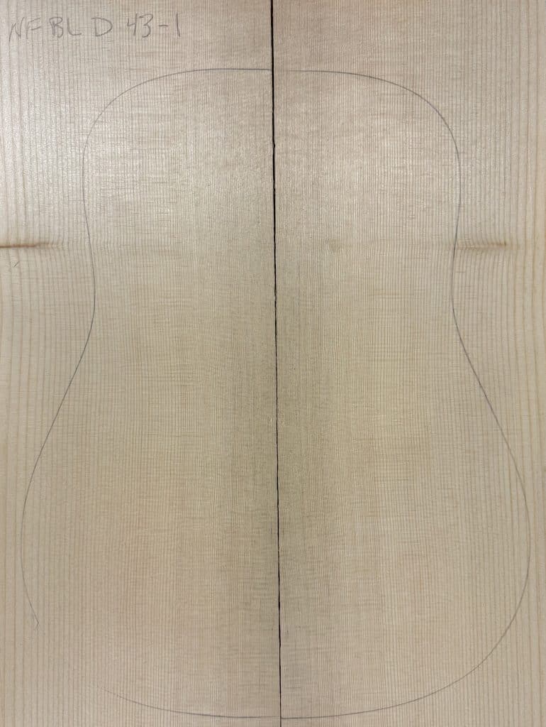 Book-matched Sitka spruce blanks with a pencil-drawn guitar body outline, demonstrating the raw material for One-of-a-Kind Guitar Tops.