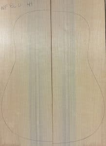 Finely-grained, light-colored wood panel with acoustic guitar outline, labeled 'NF BLD 44', representing premium Non-Figured One-of-a-Kind Guitar Tops.