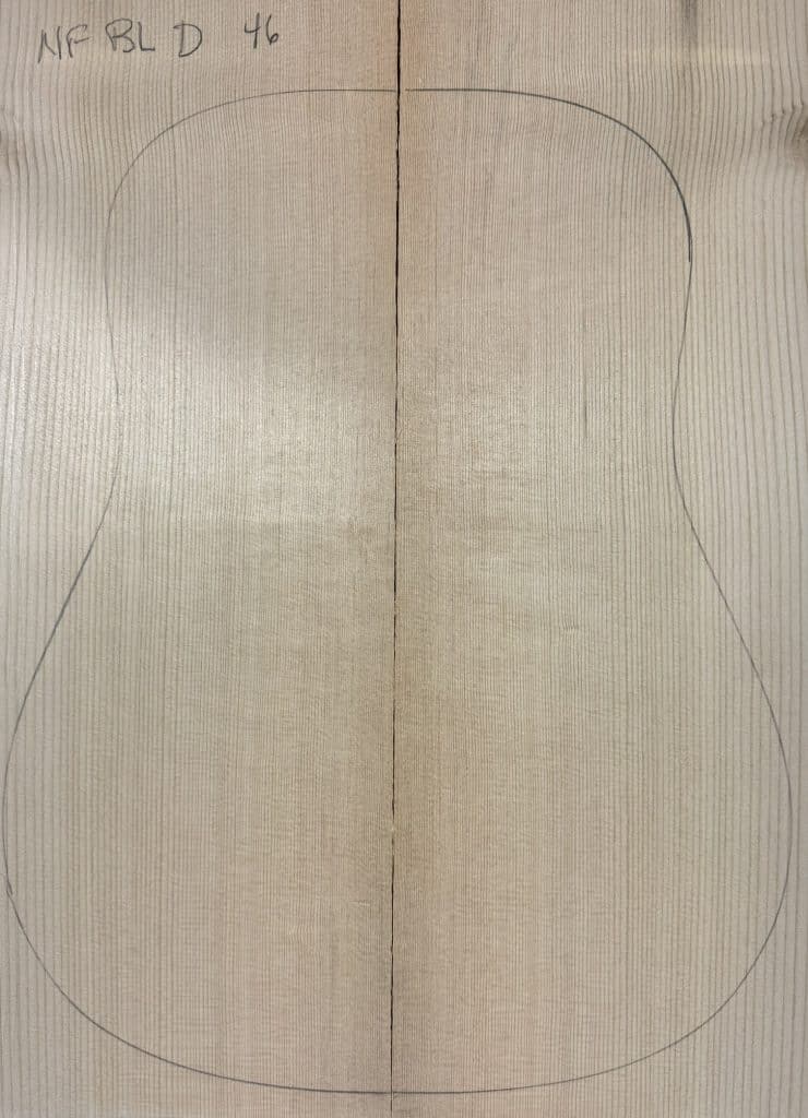 Bookmatched reclaimed Sitka Spruce panel outlined for a dreadnought acoustic guitar, showcasing our One-of-a-Kind Guitar Tops.