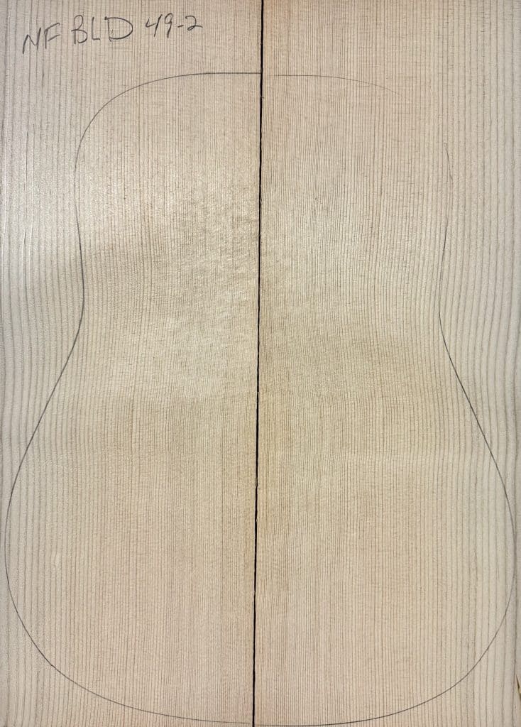 Bookmatched Sitka Spruce wood panel with a guitar body outline, ready for crafting One-of-a-Kind Guitar Tops. Labeled 'NF BLD 49-2'.