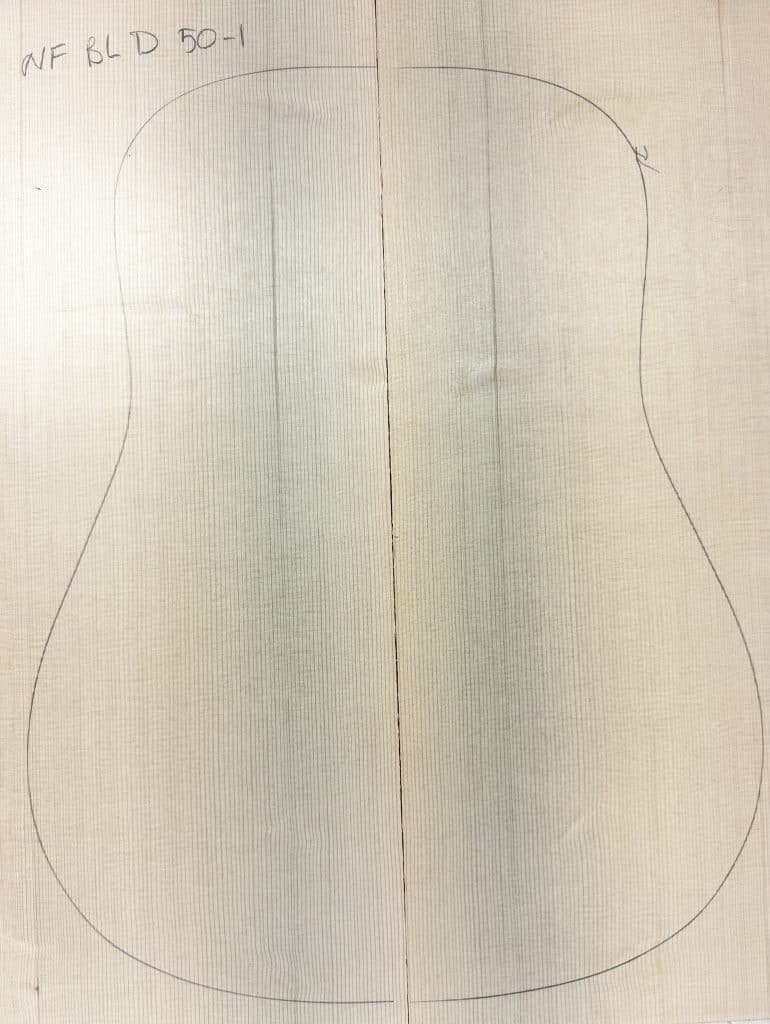 Light-toned, non-figured Sitka Spruce wood panels joined, with a pencil outline for acoustic guitar body, labeled 'NF BLD 50-1', representing One-of-a-Kind Guitar Tops.