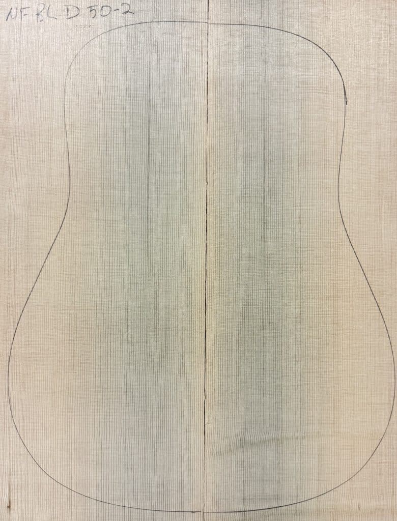 Blue non-figured Sitka Spruce wood pieces joined, outlined for One-of-a-Kind Guitar Tops.